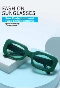 Detail view of green rectangular fashion sunglasses on minimalist geometric props