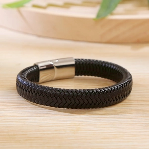 Close-up of black braided leather bracelet with silver stainless steel magnetic clasp