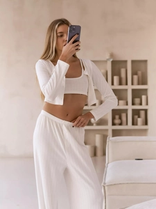 Close-up of white ribbed knit 3-piece loungewear set with soft breathable texture