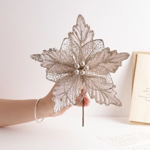 Champagne gold glitter mesh Christmas flower decoration held by hand for festive tree decor