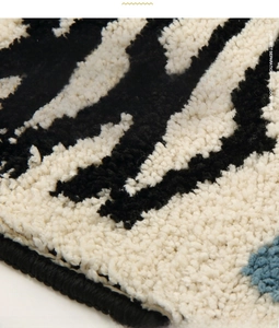 Detail of thick fiber texture on non-slip bathroom mat with striped pattern