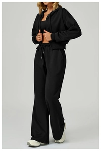 Close-up of high-waist drawstring sweatpants featuring premium knitted fabric and side pockets