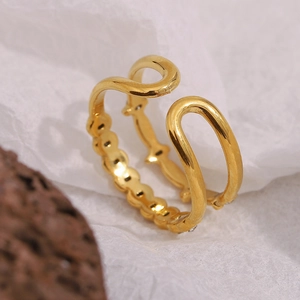 Macro detail of 18K gold-plated double-layer wavy ring with elegant beaded texture
