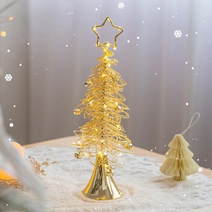 Golden wire Christmas tree with warm LED lights and star topper for festive desk decor