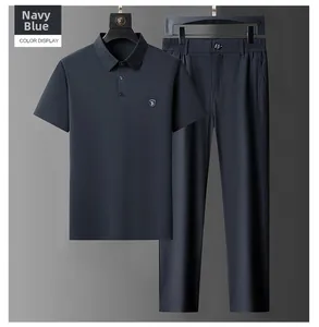 Detail of navy blue men's high-elastic polo shirt and trousers set with badge design