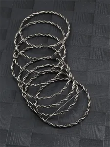 Macro detail of silver twisted rope bracelets showing 70.5mm diameter and 80.7g weight