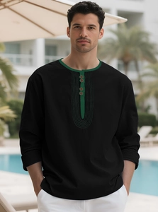 Detail of Henley shirt with green contrast placket and three wooden buttons in outdoor setting