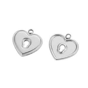 Detailed macro view of silver stainless steel heart lock pendants with keyhole and rings