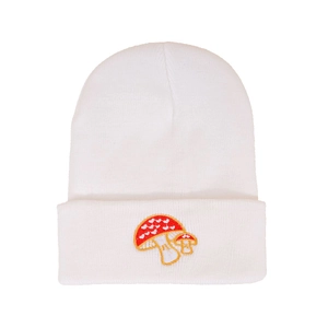 Close-up of white cuffed beanie featuring a cute mushroom and heart embroidery detail