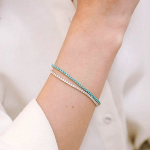 Sparkling silver tennis bracelet set with round green and clear cubic zirconia stones