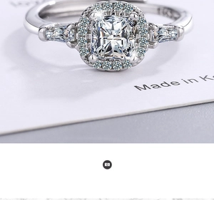 Macro shot of 925 sterling silver ring with square-cut center diamond and halo stones