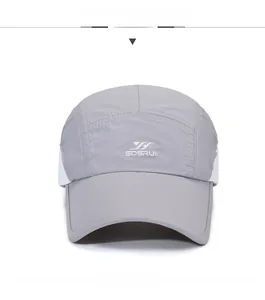 Close-up of quick-dry baseball cap with white mesh panels and SDSRUI brand logo
