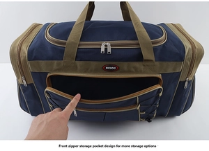 Close-up showing the front zippered storage pocket on a large capacity travel duffel bag