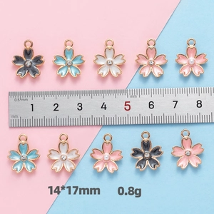 Macro shot of colorful cherry blossom charms with size ruler and 14x17mm measurement