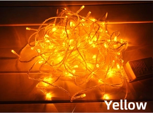 Macro shot of 10M 100 LED warm yellow string lights with white plastic controller box