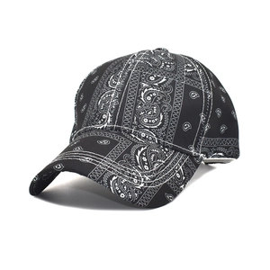 Fashion baseball cap featuring classic black and white paisley print with curved brim