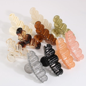 Set of 9 medium-sized matte hair claws in various translucent colors on white background