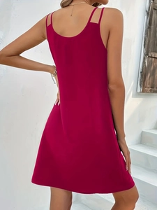 Detail of deep magenta sleeveless dress with double spaghetti straps and slim fit back view
