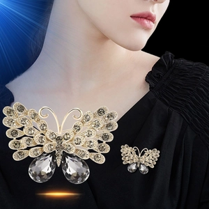 Vintage gold butterfly brooch with grey rhinestones shown on model and in detail