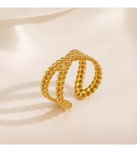Macro shot of 18K gold plated ring with double-layer cross and bubble bead texture