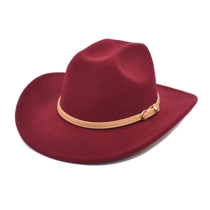 Close-up of wide brim wool jazz hat with yellow leather belt and golden buckle detail