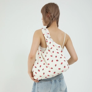 Fresh strawberry print white corduroy tote bag for women showing back view shoulder carry