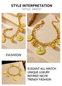 Detail of vintage gold chain bracelet with turquoise evil eye and celestial charms