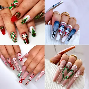 Macro view of Christmas themed long coffin press-on nails with festive reindeer and snowflake art
