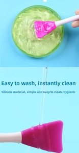 Double-headed silicone face mask brush with pink applicator head and easy wash feature