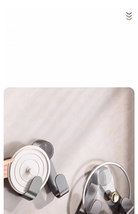 Detail of stainless steel wall mount lid rack with 360-degree rotation and suction cup