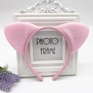 Detailed view of plush pink cat ear headband with soft fabric wrapped base for comfort