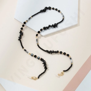 Detail of beaded glasses chain with black faceted beads and gold lobster clasps