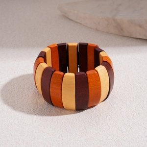 Detailed top view of geometric wooden bead stretch bracelet with natural earthy tones