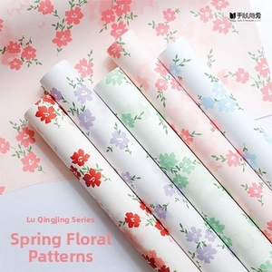 Macro shot of assorted spring floral pattern decorative paper tape rolls for DIY crafts