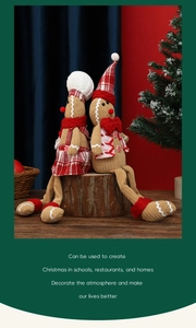 Detailed view of sitting gingerbread man dolls with corduroy fabric and holiday accents