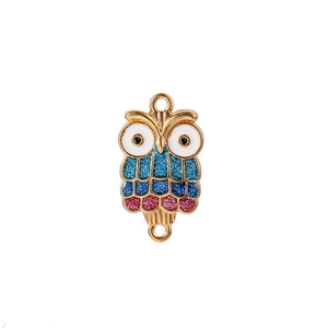 Detailed close-up of golden owl charm with blue and pink glitter enamel for jewelry making