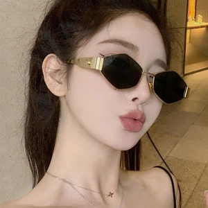 Chic hexagonal gold metal sunglasses with dark lenses and vintage embossed logo details