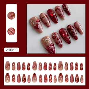 Cat eye heart cherry press-on nails with 3D bows and rhinestones in deep wine red color