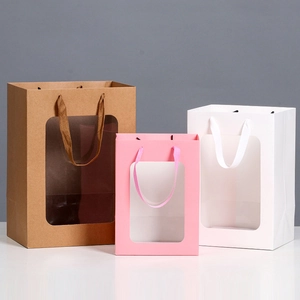 Trio of gift bags with clear windows in brown, pink, and white paper finishes