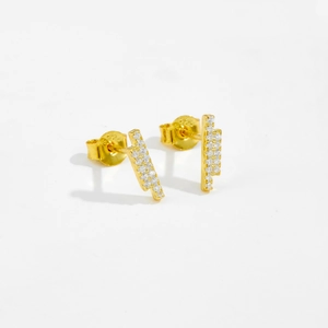 Close-up of geometric S925 sterling silver stud earrings with gold finish and zircons