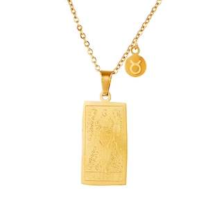 Detailed macro view of gold Taurus tarot necklace pendant and zodiac symbol charm