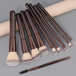 Detail of 10-piece makeup brush set with dark brown handles and dual-tone synthetic bristles
