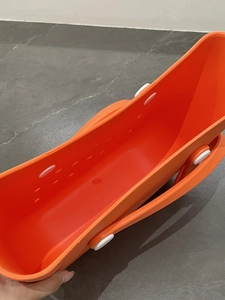 Top view of bright orange EVA beach bag showing spacious interior and DIY hole pattern