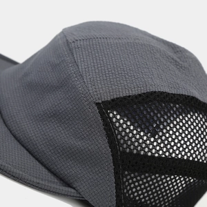 Detail view of breathable side mesh and dark gray ripstop fabric on a five-panel camping cap