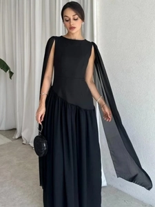 Elegant black cape sleeve maxi dress with asymmetrical pleated hem for party wear