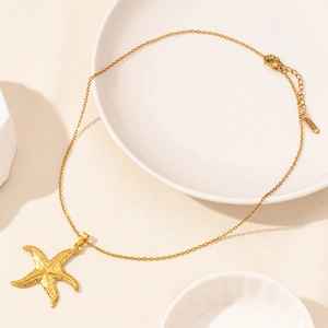 Golden starfish pendant necklace made of stainless steel with a fine textured finish