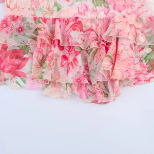 Floral print layered blouse with pink and red ruffled hem in lightweight fabric