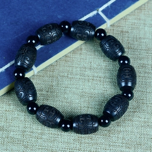Sandalwood drum beads bracelet with carved clouds and black onyx accents