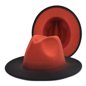 Detailed view of bicolor red and black gradient fedora hat showing interior and texture