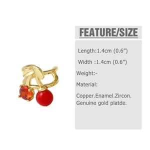 Detailed view of cherry ear cuff in gold-plated copper with red enamel and zircon stones